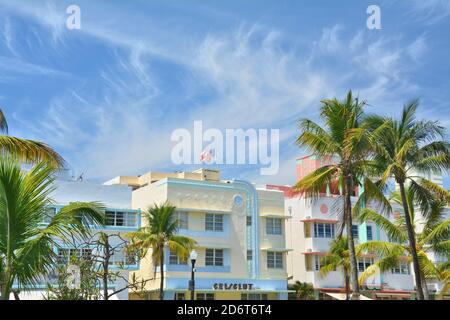 MIAMI BEACH, USA - APRIL 1, 2017 : Art Deco style buildings architecture in Miami Beach, South Beach, palm trees and blue sky. Stock Photo