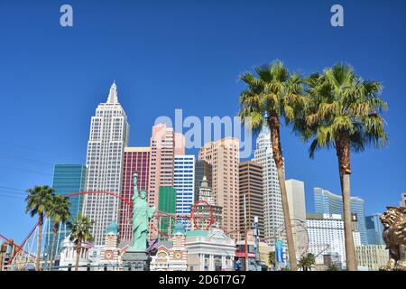 LAS VEGAS, USA - MARCH 19, 2018 : New York New York hotel on Las Vegas boulevard (The Strip). Palm trees. Stock Photo