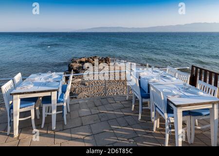 Sea view beach restaurant at sunset Stock Photo