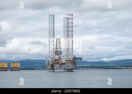 Moored oil rigs off the village of Cromarty on the Cromarty Firth, Ross and Cromarty, Black Isle, Scotland Stock Photo
