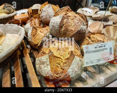 Puilboreau, France - October 14, 2020:multiple varieties of bread in the bakery section of a supermarket Stock Photo