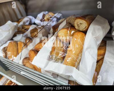 Puilboreau, France - October 14, 2020:Multitude of French bread baguete in the bakery section of a supermarket Stock Photo