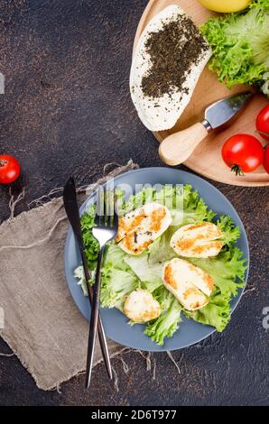 Salad with grilled halloumi cheese with green lettuce