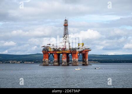 Moored oil rigs off the village of Cromarty on the Cromarty Firth, Ross and Cromarty, Black Isle, Scotland Stock Photo