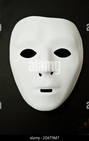 white mask on black background Stock Photo
