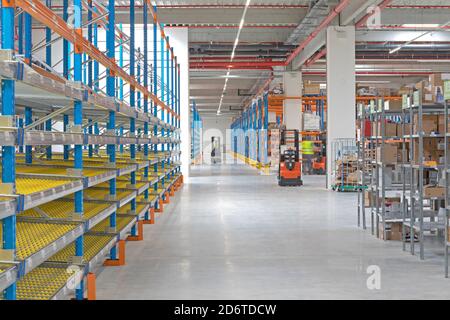 Gravity Flow Rack Shelving in Distribution Warehouse Stock Photo