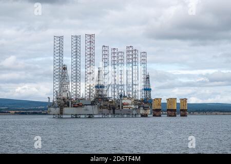 Moored oil rigs off the village of Cromarty on the Cromarty Firth, Ross and Cromarty, Black Isle, Scotland Stock Photo