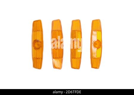 Orange reflectors for a bicycle on a white background, isolate. Reflective elements for safety, object Stock Photo