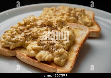 Scrambled Eggs on toast Stock Photo