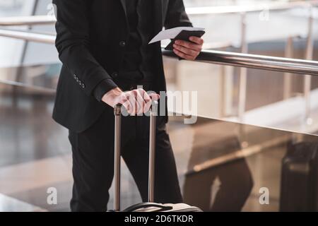 Man checking his boarding pass before the boarding Stock Photo