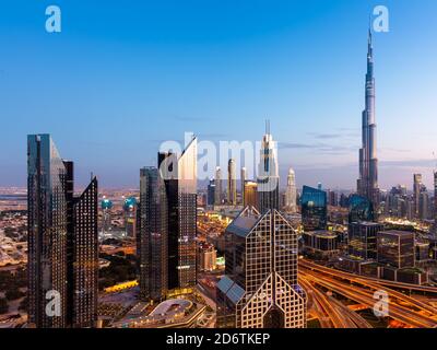 The view of the futuristic Dubai skyline at dusk, UAE. Stock Photo