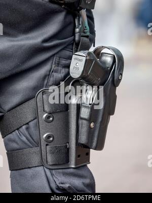 Dortmund, Ruhr area, North Rhine-Westphalia, Germany - Policeman with service weapon Walther P99 on an Anticorona demo. Stock Photo