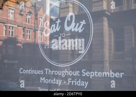As numbers of Covid-19 cases in Birmingham have dramatically risen in the past weeks, increased lockdown measures have been announced for Birmingham and other areas of the West Midlands, a sign for the now finished 'Eat Out To Help Out' campaign on 29th September 2020 in Birmingham, United Kingdom. With the rule of six also being implemented the Birmingham area has now be escalated to an area of national intervention, with a ban on people socialising with people outside their own household, unless they are from the same support bubble. Stock Photo