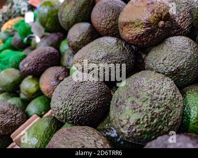 Selected focus on Group of fresh avocados sell at market Stock Photo