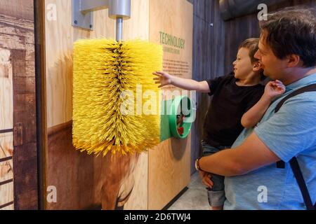 Tillamook, Oregon, USA - June 28, 2018: Dad and his son visiting the Museum at the Tillamook Cheese Factory in Tillamook, OR, USA Stock Photo