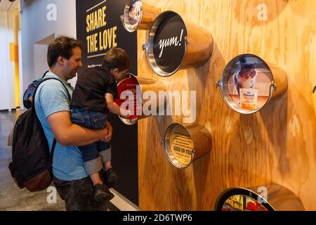 Tillamook, Oregon, USA- June 28, 2018: Dad and his son visiting the Museum at the Tillamook Cheese Factory in Tillamook, OR, USA Stock Photo