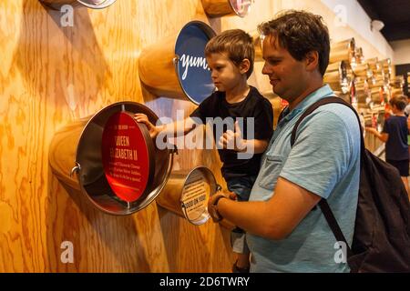 Tillamook, Oregon, USA- June 28, 2018: Dad and his son visiting the Museum at the Tillamook Cheese Factory in Tillamook, OR, USA Stock Photo