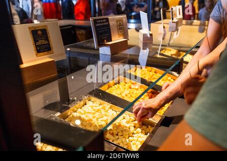 Tillamook, Oregon, USA - June 28, 2019: Cheese tasting in he Gift Shop in the Tillamook Creamery, a visitor center at the Tillamook Cheese Factory. Stock Photo