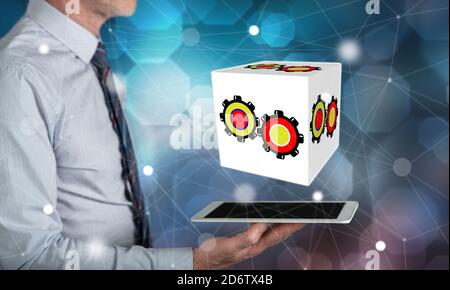Business process concept above a tablet held by a man Stock Photo