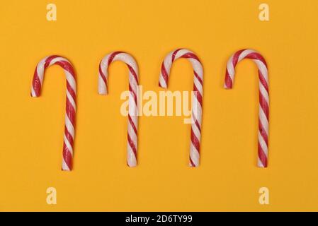 candy canes on a yellow background Stock Photo