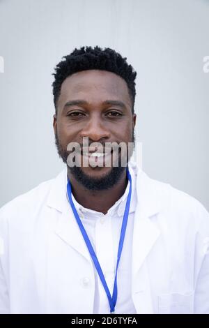 Portrait of male health professional against grey background Stock Photo