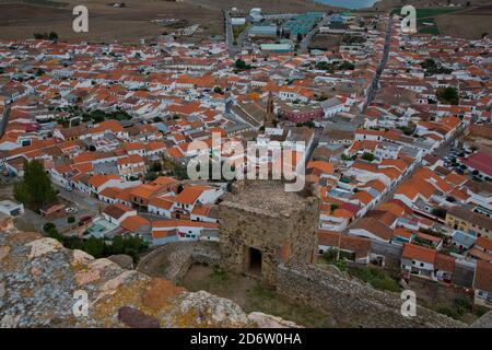 View of Andalusian village from castle with defensive walls on hill Stock Photo
