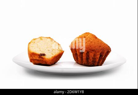 Cupcakes on a white plate. Close-up. Isolated over white background. Stock Photo