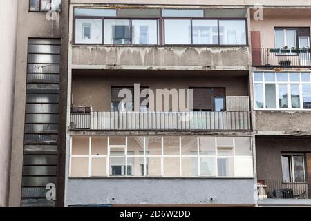 Balconies and terraces of Communist housing buildings, in a decay and diplapidated condition in Belgrade Serbia. Such towers are a symbol of Socialist Stock Photo