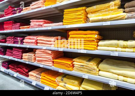 Samara, Russia - March 31, 2019: Various colored towels ready to sale on the shelves at the superstor Stock Photo