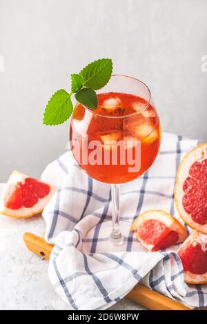 Alcohol Aperol drink with grapefruit in glass Stock Photo