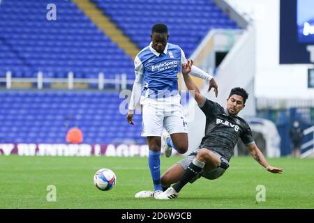 Jonathan Leko (14) of Birmingham City is tackled by Massimo Luongo (21) of Sheffield Wednesday Stock Photo