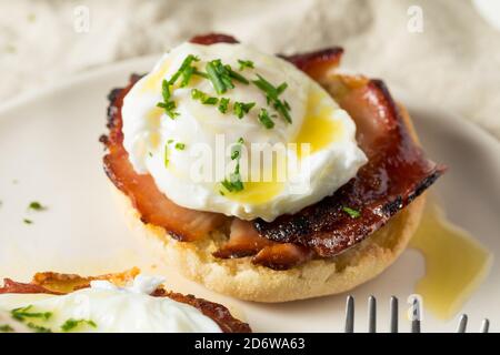 Warm Homemade Eggs Benedict with Ham and Hollandaise Stock Photo
