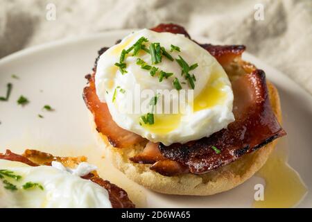 Warm Homemade Eggs Benedict with Ham and Hollandaise Stock Photo