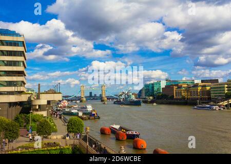 London,United Kingdom-August 13th 2016:Summer day scenic view of Thames River with tour boats navigating,the iconic Tower Bridge,City Hall Stock Photo
