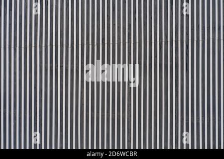 Background in the form of smooth vertical metal lines Stock Photo