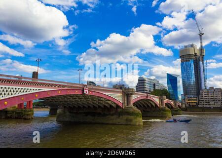 View of Thames River Blackfriars Bridge-historic 18th-century Thames River bridge with iron arches, stone carvings seen from Victoria Embankment Stock Photo