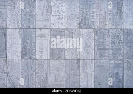 Texture of a stone wall with a carved pattern of a computer circuit board Stock Photo