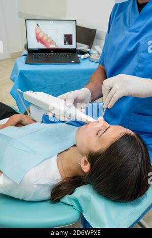 Digital dental impression with intraoral camera intended for the realization of a dental prosthesis, Center Cosem Paris. Stock Photo