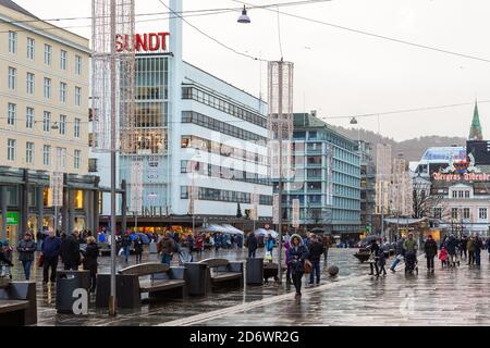 Bergen, Norway- 12 December 2015: People on the main square Torgallmenningen in th city. Christmas decor. Stock Photo