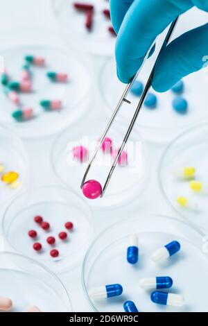 Drugs in petri dishes awaiting anaylsis, pharmaceutical research. Stock Photo