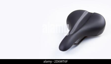 Bicycle saddle on white background, close-up view, studio photo. copyspace for text. Stock Photo