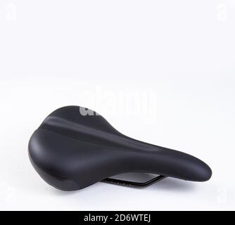 Bicycle saddle black on white background, close-up view, studio photo Stock Photo