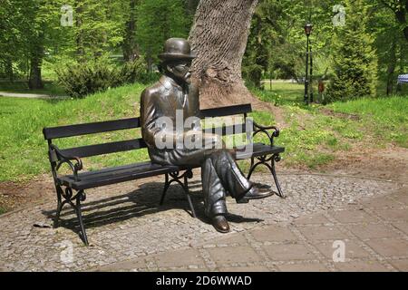 Bench of Boleslaw Prus at Spa park in Naleczow. Swietokrzyskie Voivodeship. Poland Stock Photo