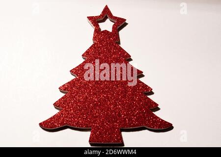 isolated red christmas tree with glitters on white background Stock Photo