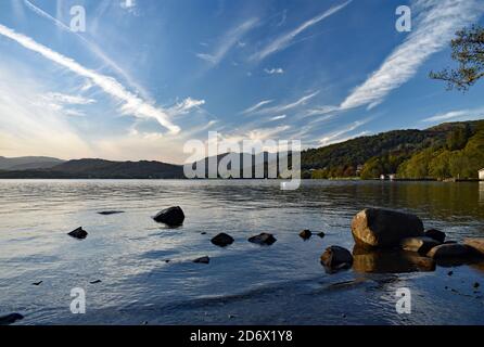 Sunset over Lake Windermere from the Brockhole estate in Lake District National Park, England. The calm water reflects the colours of the sky. Stock Photo