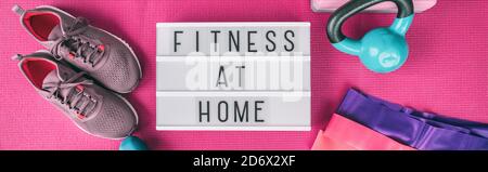 Fitness at home exercise training with weights and resistance bands banner . Running shoes and kettlebell top view of lightbox sign with text for Stock Photo