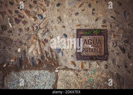 Road surface, old paving stone on the pavement. Stock Photo
