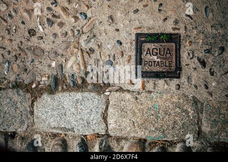 Road surface, old paving stone on the pavement. Stock Photo