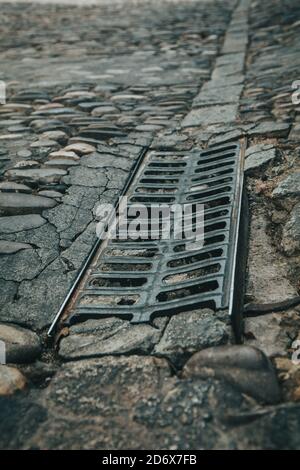 Road surface, old paving stone on the pavement. Stock Photo