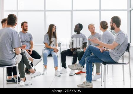 group of young like-minded people discussing their ideas Stock Photo